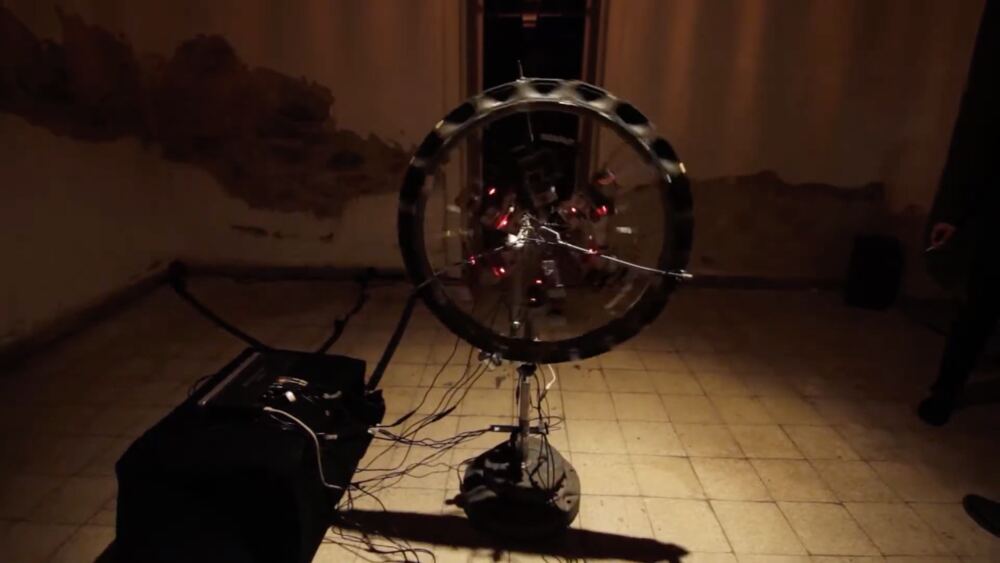 The wheel in the dark, lit from one side
