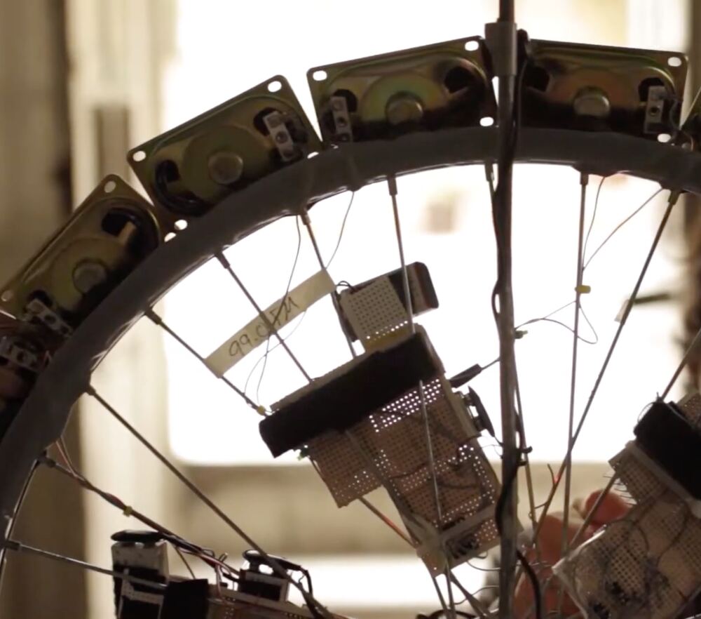 Close up of the speakers around the rim and a receiver on the spokes