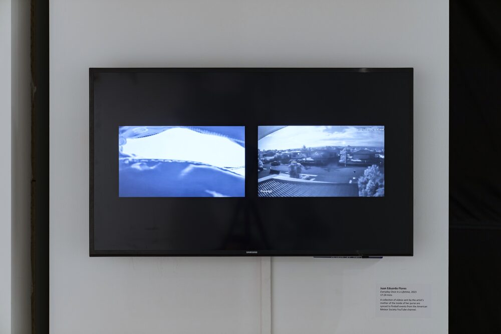 Two videos side by side on a wall-mounted TV