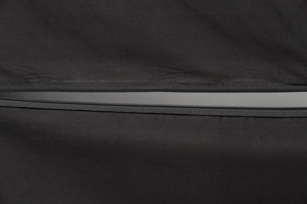 The curtain's zipper, closed